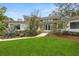 Inviting home exterior with manicured lawn and stone accents at 12550 Lakeshore Dr, Clermont, FL 34711