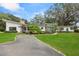 Charming home with a well-maintained lawn and elegant landscaping at 12550 Lakeshore Dr, Clermont, FL 34711