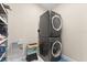 The laundry room features a stacked washer and dryer set at 12550 Lakeshore Dr, Clermont, FL 34711