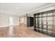 Spacious living area with hardwood floors and access to other rooms at 12550 Lakeshore Dr, Clermont, FL 34711