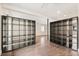Open living area with hardwood floors and decorative bookshelves at 12550 Lakeshore Dr, Clermont, FL 34711