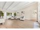 Spacious living area with vaulted ceilings and hardwood floors at 12550 Lakeshore Dr, Clermont, FL 34711