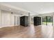 Large open space with sliding glass doors, access to the backyard and hardwood floors at 12550 Lakeshore Dr, Clermont, FL 34711