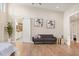 Comfortable main bedroom featuring hardwood floors, a seating area, ensuite bathroom access and tranquil ambiance at 12550 Lakeshore Dr, Clermont, FL 34711