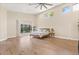 Bright main bedroom boasts wood floors, large windows, and natural light at 12550 Lakeshore Dr, Clermont, FL 34711
