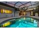 Screened in pool and patio area with ample seating, perfect for outdoor entertaining and relaxation at 12550 Lakeshore Dr, Clermont, FL 34711