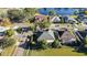 Aerial view of home showcasing its proximity to a tranquil lake and neighborhood streets at 12924 Lower River Blvd, Orlando, FL 32828