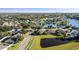 Picturesque aerial shot of a residential neighborhood by a lake, showcasing the community's layout at 12924 Lower River Blvd, Orlando, FL 32828