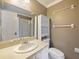 Bathroom featuring a single sink vanity, toilet, and glass-enclosed shower at 12924 Lower River Blvd, Orlando, FL 32828