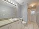 Neutral bathroom featuring a vanity with a sink, a toilet, and a shower/tub combo at 12924 Lower River Blvd, Orlando, FL 32828