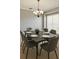 Chic dining room with modern table setting and chandelier at 12924 Lower River Blvd, Orlando, FL 32828