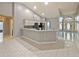 Bright kitchen with stainless steel appliances, gray cabinets, and breakfast bar at 12924 Lower River Blvd, Orlando, FL 32828