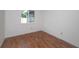 Bright bedroom with wood flooring and large window at 1420 Moorland Ct, Longwood, FL 32750