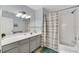 Well-lit bathroom with tub, shower, and updated fixtures at 2203 San Vittorino Cir # 102, Kissimmee, FL 34741