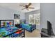 Bedroom with two twin beds, TV, and ceiling fan at 2203 San Vittorino Cir # 102, Kissimmee, FL 34741