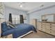 Bedroom with a queen bed, dresser, and ceiling fan at 2203 San Vittorino Cir # 102, Kissimmee, FL 34741