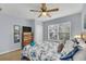 Serene bedroom with a queen-size bed, dresser and window at 2203 San Vittorino Cir # 102, Kissimmee, FL 34741