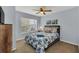 Cozy bedroom with a full-size bed, nightstand and window at 2203 San Vittorino Cir # 102, Kissimmee, FL 34741