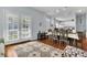 Open concept dining area with kitchen and access to backyard at 2203 San Vittorino Cir # 102, Kissimmee, FL 34741