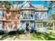 Charming two-story townhome with blue siding and a front porch at 2203 San Vittorino Cir # 102, Kissimmee, FL 34741