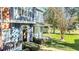 Two-story townhome with blue siding, front porch, and landscaped yard at 2203 San Vittorino Cir # 102, Kissimmee, FL 34741