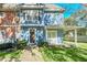 Inviting two-story townhome with front porch and landscaping at 2203 San Vittorino Cir # 102, Kissimmee, FL 34741