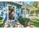 Dark brown front door with sidelights and a small porch at 2203 San Vittorino Cir # 102, Kissimmee, FL 34741