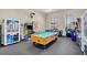 Community game room with a pool table and arcade games at 2203 San Vittorino Cir # 102, Kissimmee, FL 34741