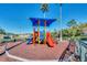 Community playground with shaded play structures for children at 2203 San Vittorino Cir # 102, Kissimmee, FL 34741