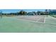Community tennis courts with green surface and surrounding fence at 2203 San Vittorino Cir # 102, Kissimmee, FL 34741