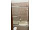 Bathroom featuring a combination shower and tub, along with tile walls at 118 Cedar Rd, Ocala, FL 34472