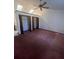 Bedroom featuring built in closets, carpet floors, a ceiling fan, and natural lighting at 118 Cedar Rd, Ocala, FL 34472