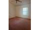 Bedroom featuring neutral walls, carpet floors, a ceiling fan, and natural lighting at 118 Cedar Rd, Ocala, FL 34472