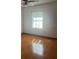 The bedroom has hardwood floors and a ceiling fan with lots of natural light at 118 Cedar Rd, Ocala, FL 34472