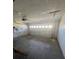 Spacious two car garage with high ceilings and a door leading to the exterior at 118 Cedar Rd, Ocala, FL 34472