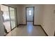 Bright living room boasts tile flooring and sliding glass doors to the outdoors at 118 Cedar Rd, Ocala, FL 34472