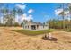 Single-story home with new construction, showcasing a spacious backyard with ample green space at 13516 Sw 78 Pl, Dunnellon, FL 34432