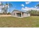 Backyard featuring lush green grass, perfect for outdoor activities and relaxation at 13516 Sw 78 Pl, Dunnellon, FL 34432