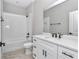Modern bathroom features white subway tiles, quartz countertop, and sleek black fixtures at 13516 Sw 78 Pl, Dunnellon, FL 34432