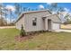 Charming single-story home with attached garage and landscaped lawn at 13516 Sw 78 Pl, Dunnellon, FL 34432