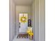 Welcoming front porch featuring a charming wreath, a welcome mat, and lemon decor at 13516 Sw 78 Pl, Dunnellon, FL 34432