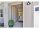 Inviting entryway with a cheerful wreath and a glimpse of the well-lit interior at 13516 Sw 78 Pl, Dunnellon, FL 34432