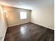 Bedroom with wood-look floors and neutral decor at 171 Springwood Cir # B, Longwood, FL 32750