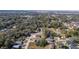 Expansive aerial view showcasing the neighborhood's lush greenery and residential homes, creating a peaceful community setting at 205 E 17Th St, Apopka, FL 32703