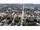 Aerial view of neighborhood showcasing tree-lined streets with well-maintained homes, offering a peaceful community setting at 205 E 17Th St, Apopka, FL 32703