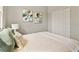 Cozy bedroom featuring plush bedding, stylish artwork, and a spacious closet at 205 E 17Th St, Apopka, FL 32703