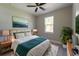 Comfortable bedroom with a ceiling fan, natural light, and stylish furnishings at 205 E 17Th St, Apopka, FL 32703