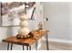 Tastefully decorated entryway featuring a wooden console table with elegant decor and modern artwork at 205 E 17Th St, Apopka, FL 32703