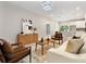 Stylish open-plan living room with modern furniture, wood accents, and a view of the sleek kitchen at 205 E 17Th St, Apopka, FL 32703