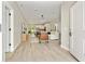 Open-concept living area with wood floors, modern furniture, and ample natural light flowing through the space at 205 E 17Th St, Apopka, FL 32703